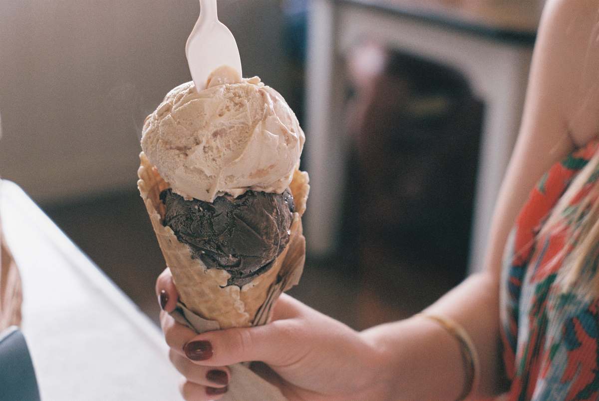 ice cream person holding vanilla flavor ice cream cream
